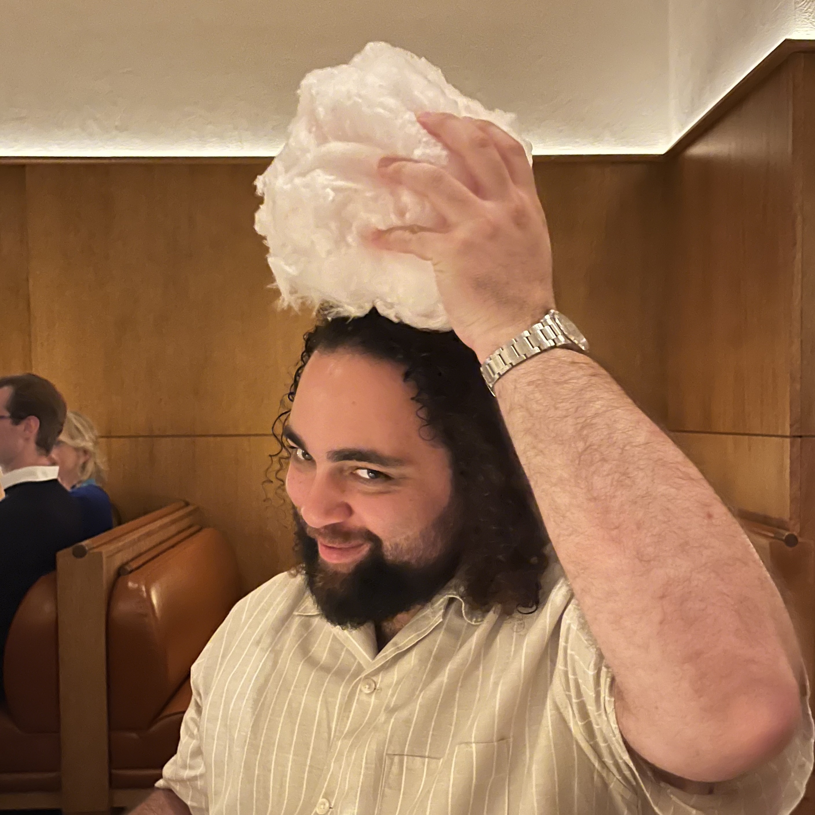 A picture of the most handsome person with their head in the clouds